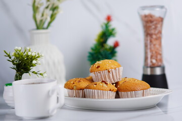 Golden Brown Peanut Muffins on white Plate
