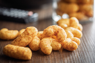 Puffed crispy Peanut flips on wooden table.