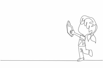 Single one line drawing little girl standing while reading a book. Practicing what is read. Full of joy and lots of funny expressions. World Read Aloud Day. Continuous line design graphic illustration