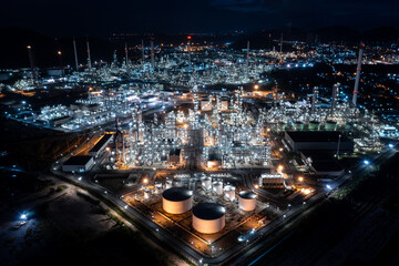 Aerial view oil and gas storage tank, oil refinery factory plant at night form industry zone, Oil refinery petrochemical plant factory at twilight, 