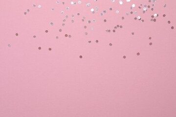 Beautiful sparkling confetti on a color background