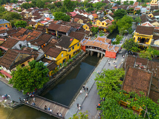 Aerial view of Chua Cau or Japanese Covered ancient Bridge and River in Old city of Hoi An, Vietnam. Vietnamese heritage and culture in Hoian ancient town