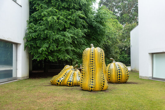 Porto, Portugal - Mai 28, 2024 - Contemporary art sculptures Polka Dots in shape of pumpkins in the park of the Serralves foundation, Porto, created by Yayoi Kusama