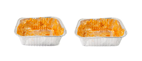 Empty aluminium foil tray isolated, lasagne food remains in dirty packaging for heating, food waste