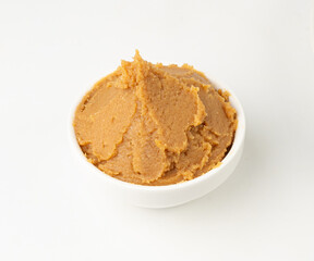 Miso paste isolated. Japanese shiro miso seasoning sauce, fermented soybean spread, brown soy cream