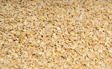 Dry raw oat flakes texture background, rolled flat grains pattern, instant porridge mockup, thin cereals