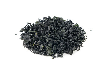 Wakame seaweed pieces isolated, edible raw algae, dry undaria pinnatifida healthy food kelp