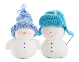 Two cute decorative snowmen isolated on white