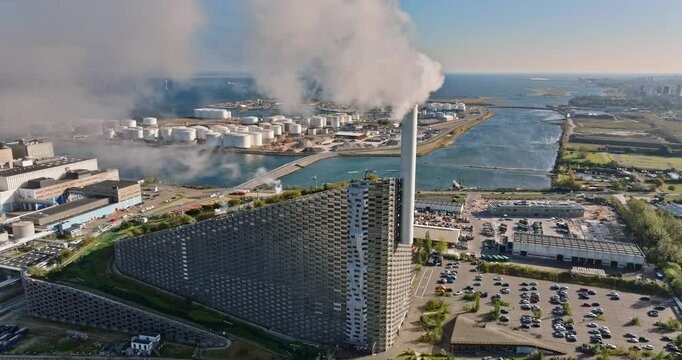 Aerial drone view of CopenHill artificial ski slope on the roof of an energy plant