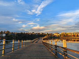 Fototapeta premium wooden bridge over the river in autumn