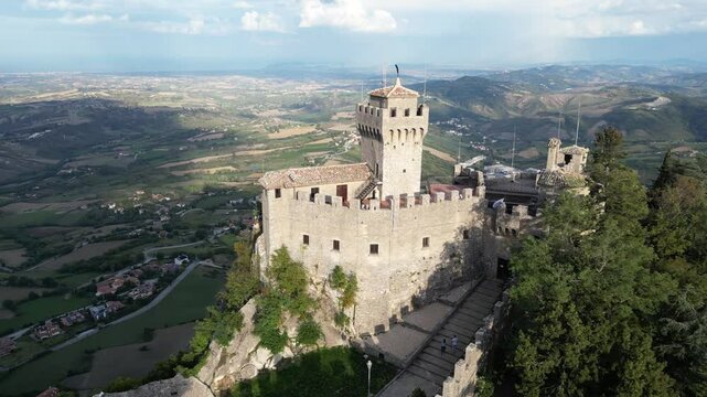 drone rotate around on of the famous Three Towers of San Marino group of fortress medieval castle located on the three peaks of Monte Titano in the capital of republic San Marino in Italy micro state