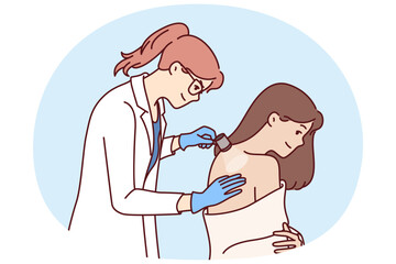Woman dermatologist examines skin on patient back to help get rid of rash or acne. Girl in white coat works as dermatologist in private clinic and uses flashlight to give useful skincare tips