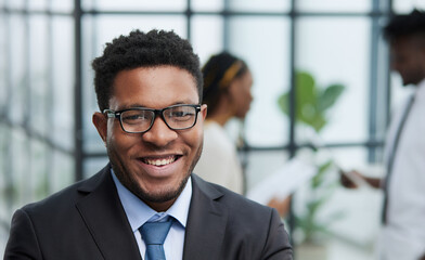 Head shot of confident young handsome black man looking at camera.