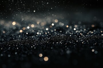 Smooth black granite surface with sparkling flecks, reflecting light and creating a sleek modern look, ideal for kitchen countertops or contemporary spaces