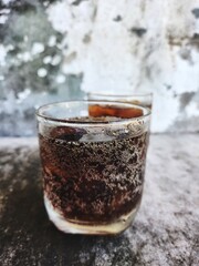 Cola drink with ice cubes