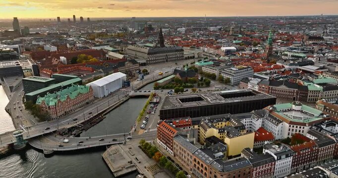 Aerial drone view of the Christiansborg Palace on the islet of Slotsholmen in central Copenhagen, Denmark at sunset