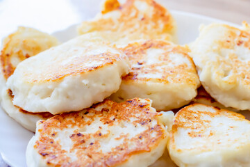 Cooked cheesecakes for breakfast close-up. Delicious breakfasts made from cottage cheese