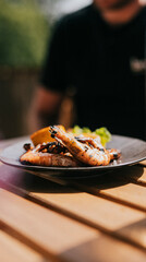 A plate with some grilled prawns