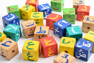 Wooden Arabic Alphabet Blocks isolated on white background. Arabic Alphabet Cubes. Preschool and...