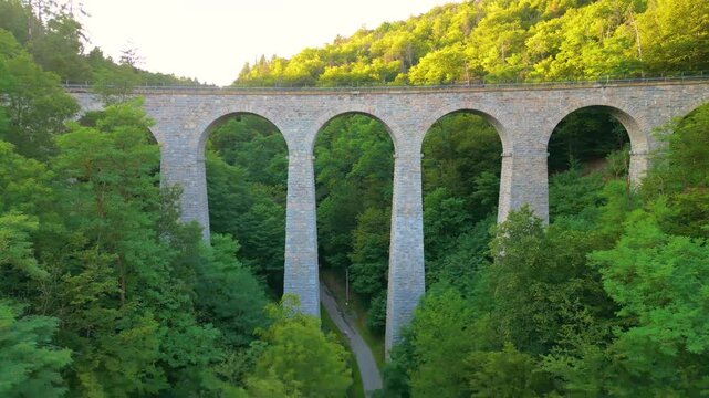 Discover the Zampach railway bridge, the tallest stone bridge in Czechia, surrounded by lush greenery and scenic landscapes. Experience the beauty of this architectural marvel.