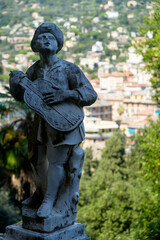 Statue of a musician in the garden of Villa Durazzo in Santa Margherita Ligure, Italy