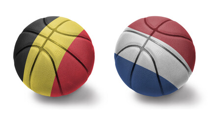 basketball balls with the national flags of netherlands and belgium on the white background.