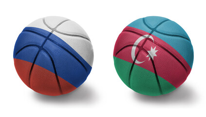 basketball balls with the national flags of azerbaijan and russia on the white background.