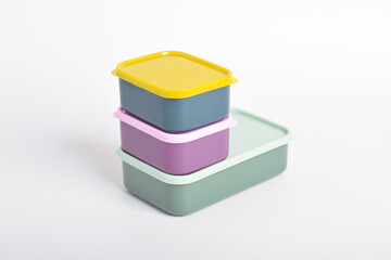 Three colorful Lunch Boxes isolated on white background. Plastic food containers