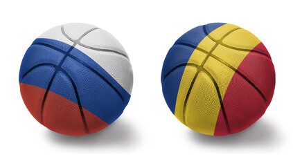 basketball balls with the national flags of romania and russia on the white background.