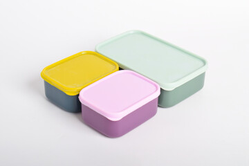 Three colorful Lunch Boxes isolated on white background. Plastic food containers