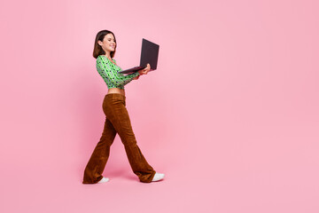 Photo of lovely charming woman wear green stylish clothes use modern apple netbook isolated on pink...