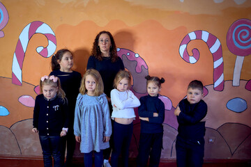 5-7 year old children at an acting class, group photo with their teacher