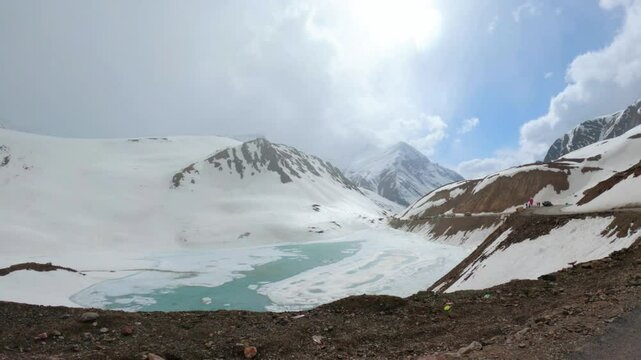 4K shot of frozen Suraj Tal lake as seen on the way towards Bara Lacha La Pass in Lahaul and Spiti district, Himachal Pradesh, India. Frozen lake due to the cold temperatures in winter season.