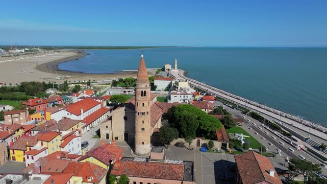 aerial slider view of the most recognizable landmarks of Caorle Italy, Duomo di Santo Stefano Protomartire, and the Madonna dell'Angelo Church