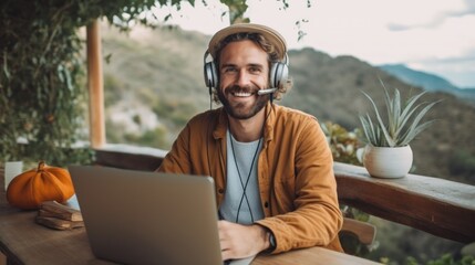 Smiling Man Working on Laptop