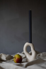 Handmade beeswax candle, interior design with authentic decor