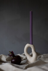 Handmade beeswax candle, interior design with authentic decor