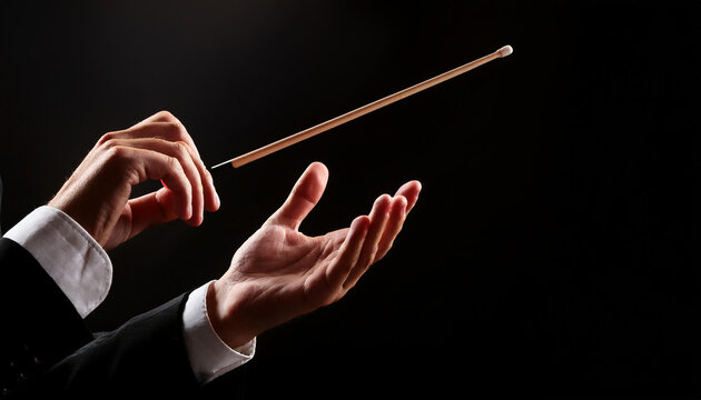 Close up de las manos de un director de orquesta con una batuta dirigiendo en fondo negro para conciertos, &oacute;pera, m&uacute;sica cl&aacute;sica eventos culturales carteles de &oacute;pera, festivales y campa&ntilde;as musicales