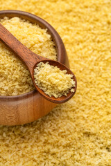 Yellow japanese panko crumbs in the spoon and bowl.