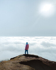 Man looking a sea of clouds