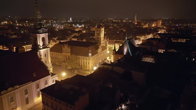 Night view from a drone of illuminated Torun, Poland