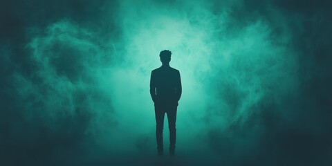A solitary figure stands in a misty environment, evoking contemplation and introspection.