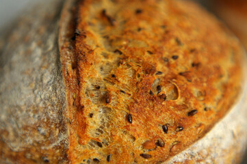 Crust with sesame seeds of home baked sourdough bread