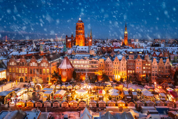 Beautifully lit Christmas market in the Main City of Gdansk during a snowfall. Poland