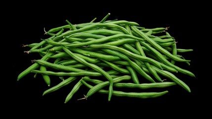 Fototapeta premium A pile of fresh green beans on a black background, showcasing their vibrant color and texture.