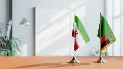 FLAGS OF IRAN AND ZAMBIA ON TABLE