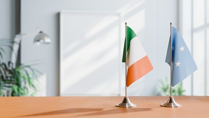 FLAGS OF IRELAND AND MICRONESIA ON TABLE