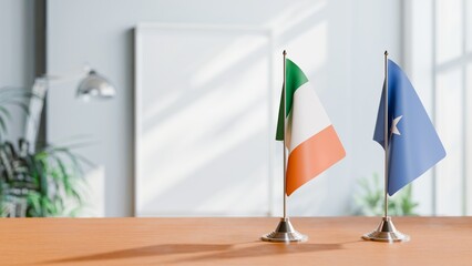 FLAGS OF IRELAND AND SOMALIA ON TABLE