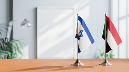 FLAGS OF ISRAEL AND SUDAN ON TABLE