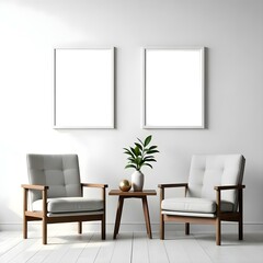 Two gray armchairs with wooden frames, a small wooden table between them, and two blank white frames on the wall above.